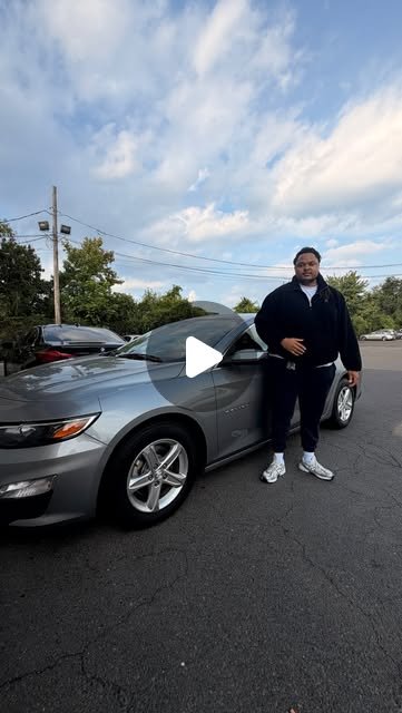 Delivery day — customer picking up keys at the lot